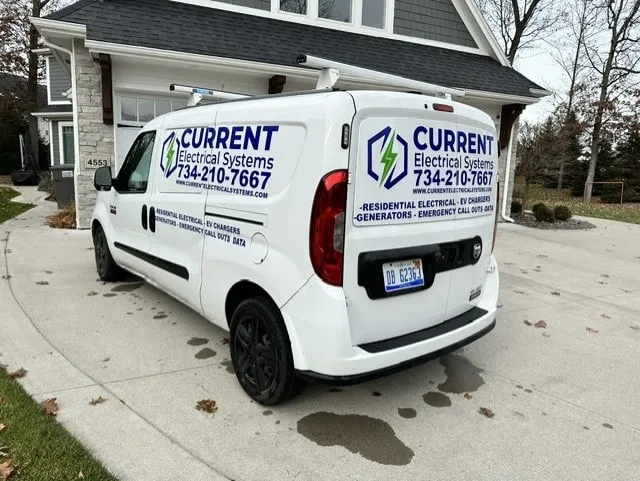 Current Electrical Systems work van parked in a customer's driveway